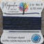 Bead thread with 'Magnolia Bead Company' label on a wooden surface