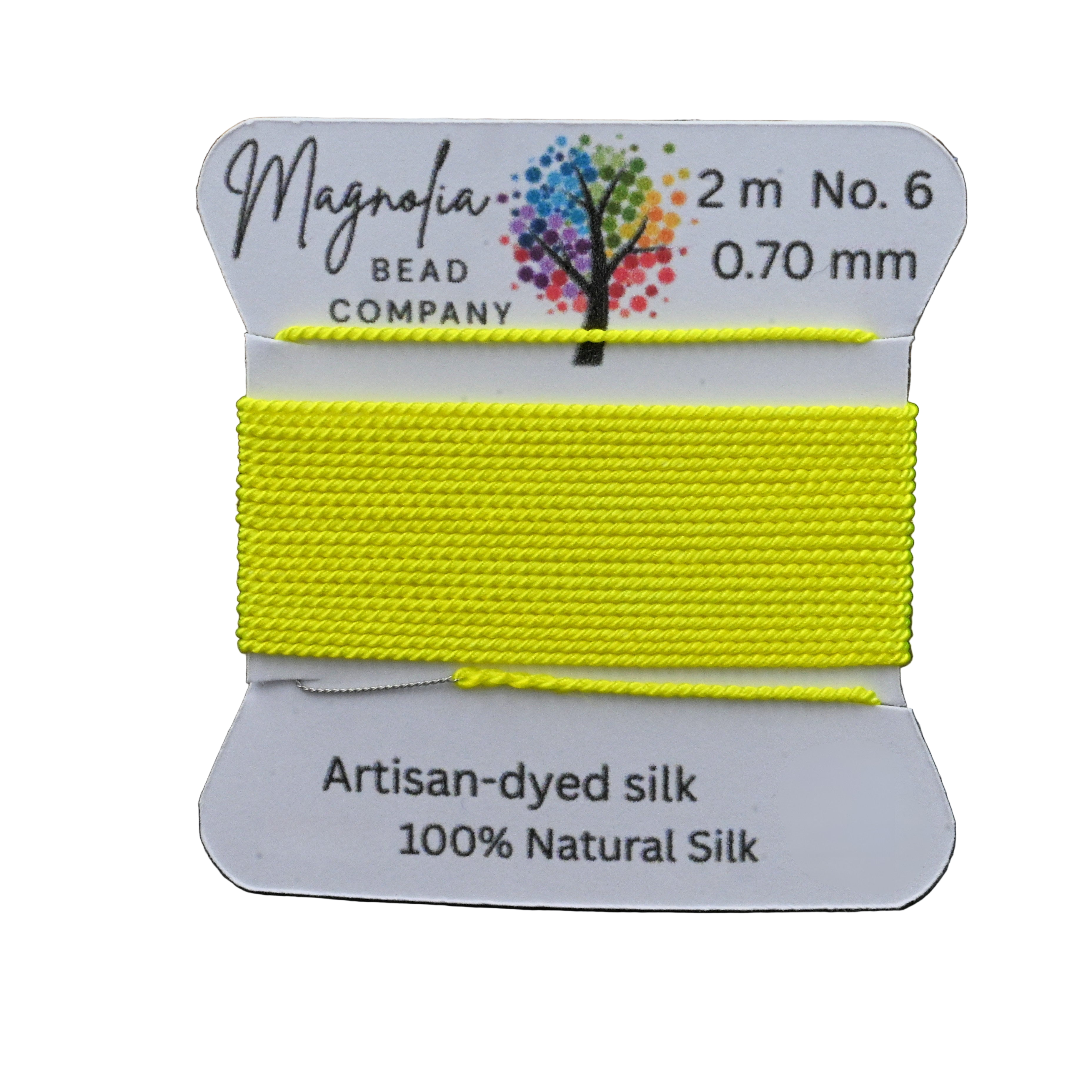 Yellow thread on a card with Magnolia Bead Company branding against a wooden background