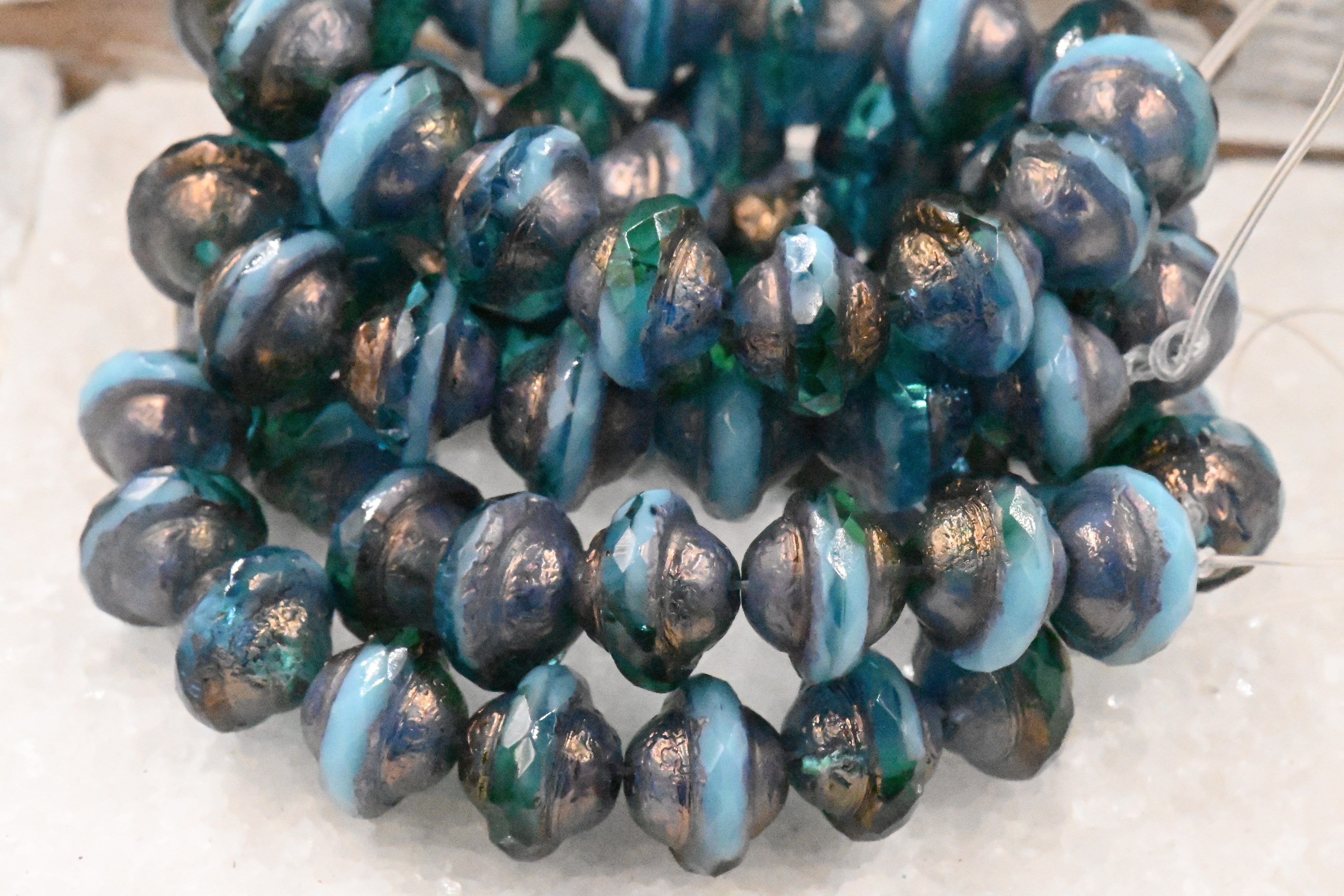 15pc Czech Glass Beads 10x8mm Saturn Teal and Sky Blue with an Etched Finish and Bronze and Gold Washes