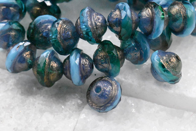 15pc Czech Glass Beads 10x8mm Saturn Teal and Sky Blue with an Etched Finish and Bronze and Gold Washes Hover Image
