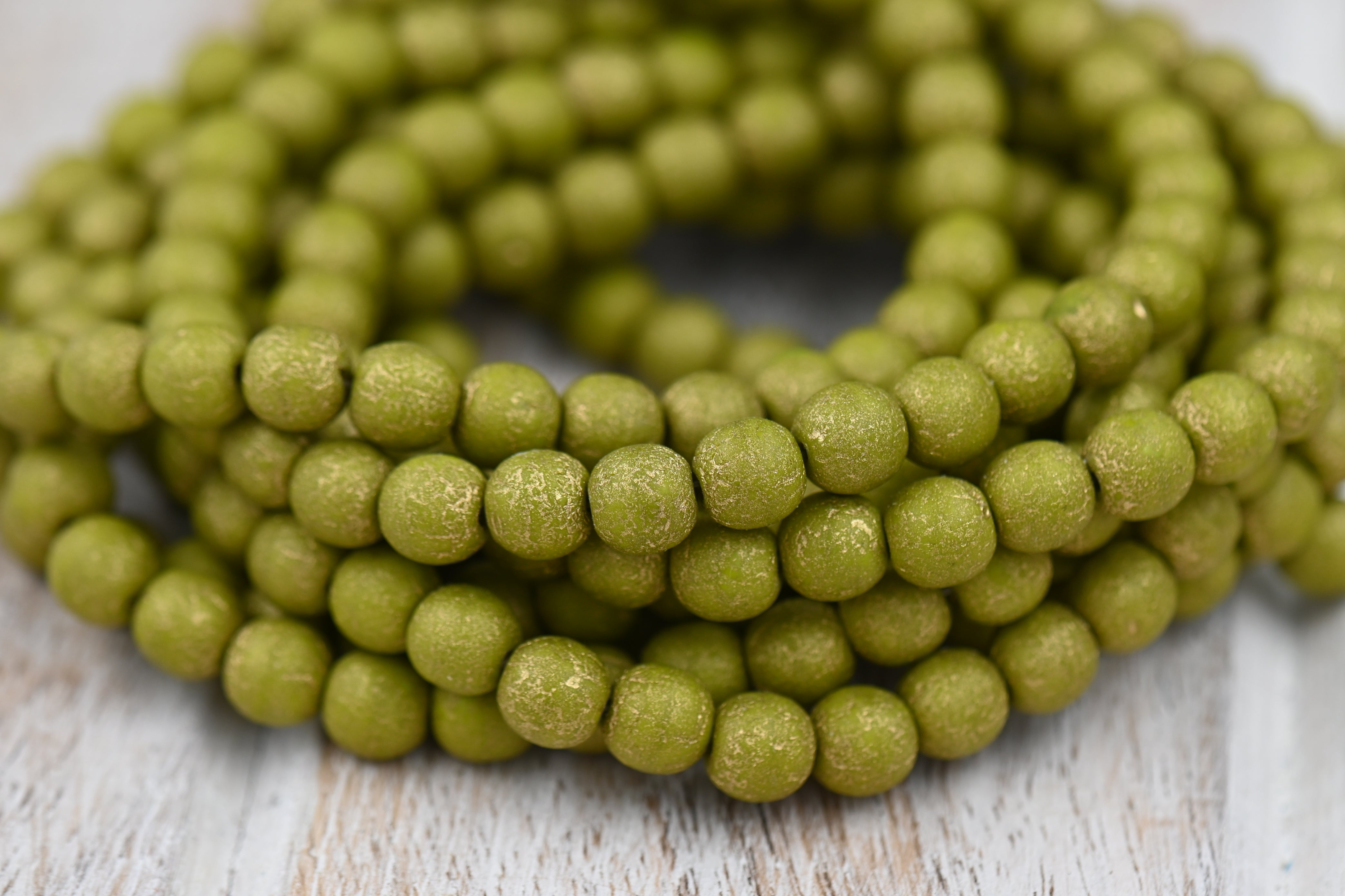 Czech 6mm Round Druk Peridot with an Etched Finish and a Gold Wash, 60