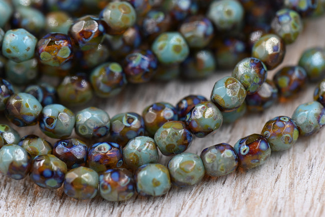 4mm Czech Faceted Round 100pc Firepolished Bead Amber and Tea Green with Picasso Finish Hover Image