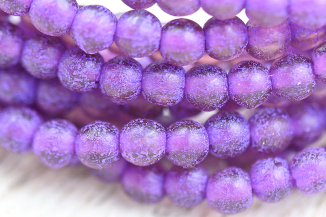 Czech 4mm Round Druk Purple 50pc with a Purple Wash and Etched Finish Hover Image