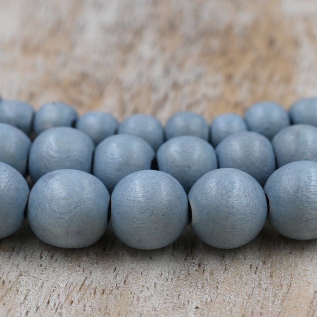 Winter Dusk Blue — Dyed Waxed Wood Beads in Soft Frosted Blue Hover Image