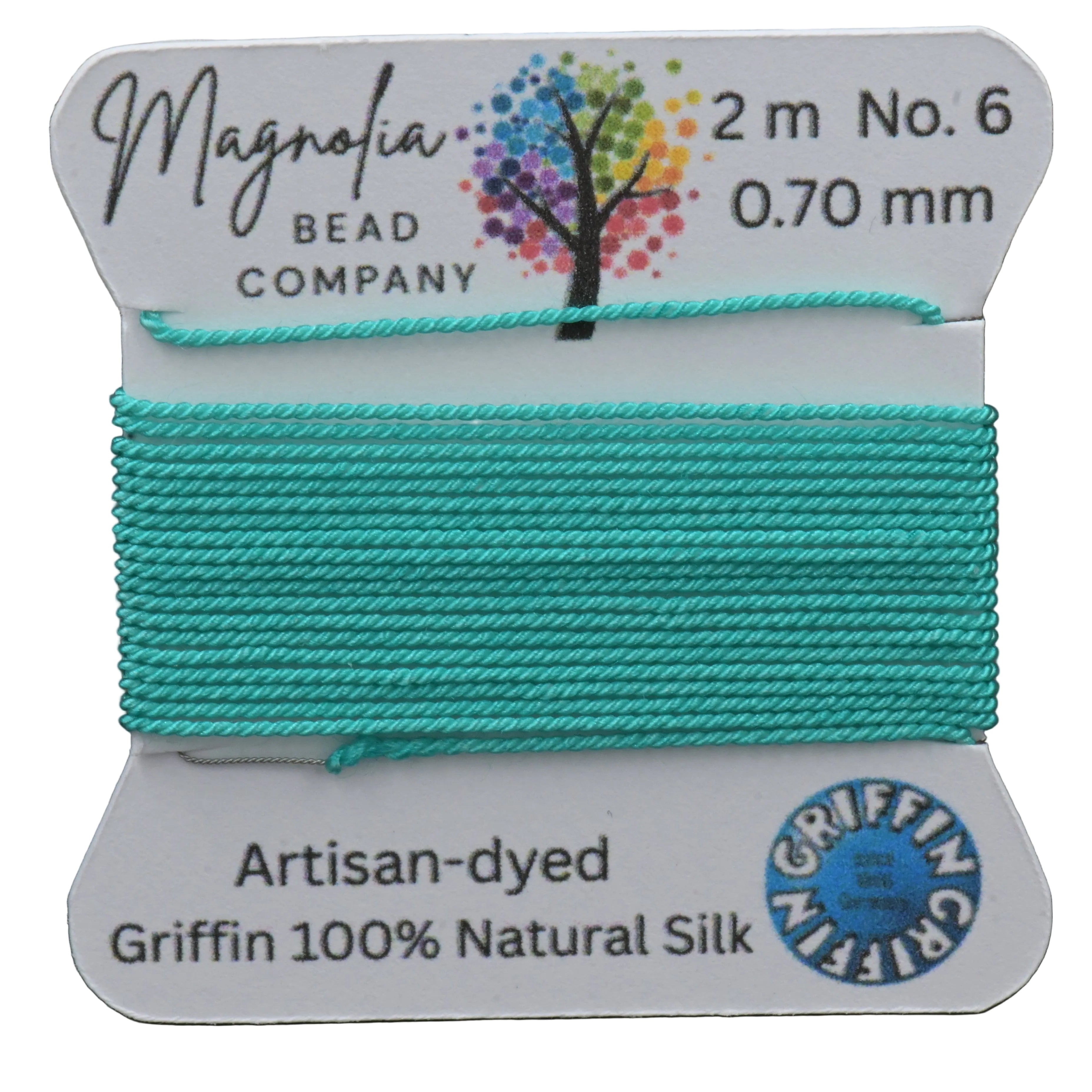 Turquoise thread on a Magnolia Bead Company label with brand details.