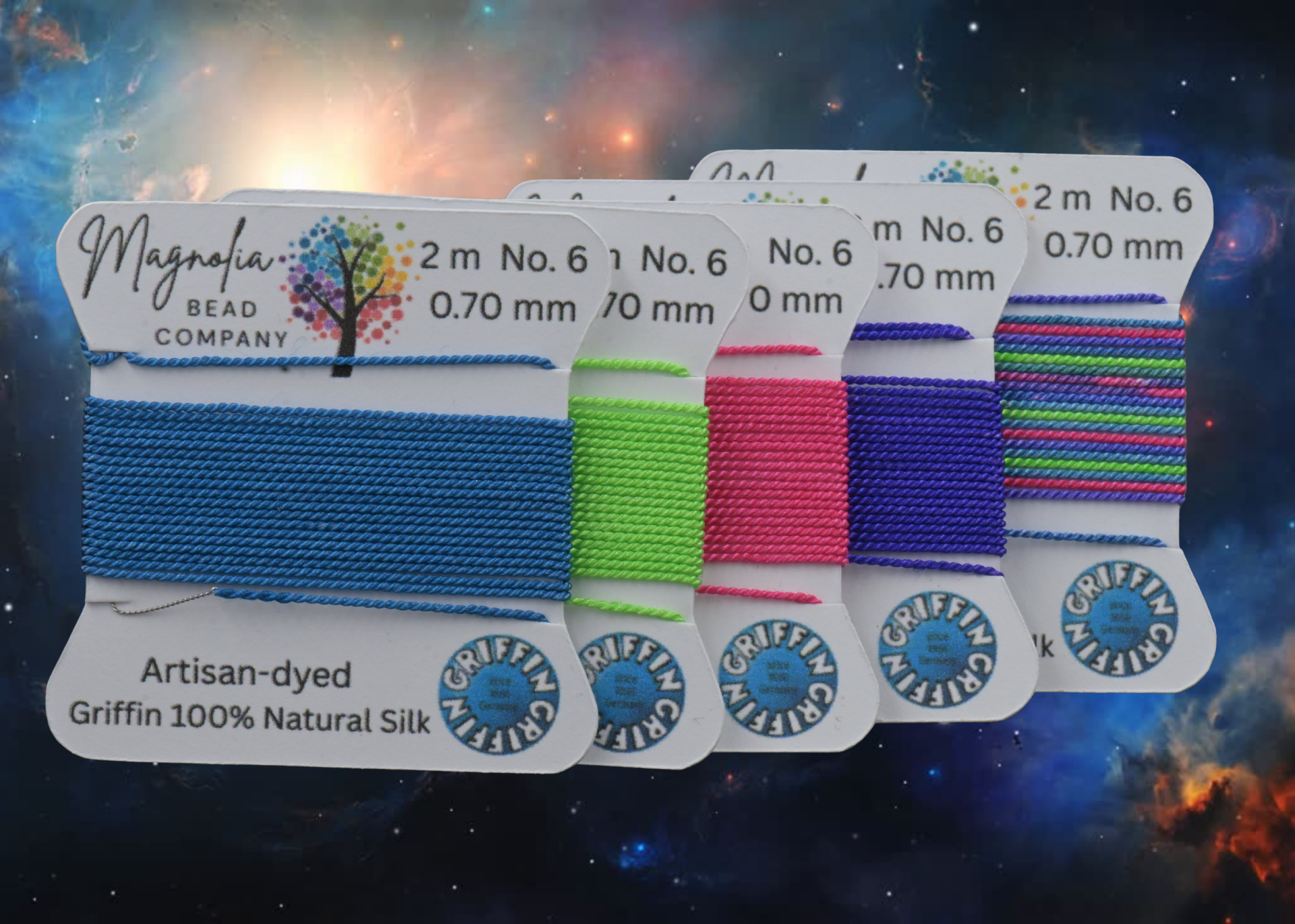 Set of colorful thread spools with labels on a dark surface