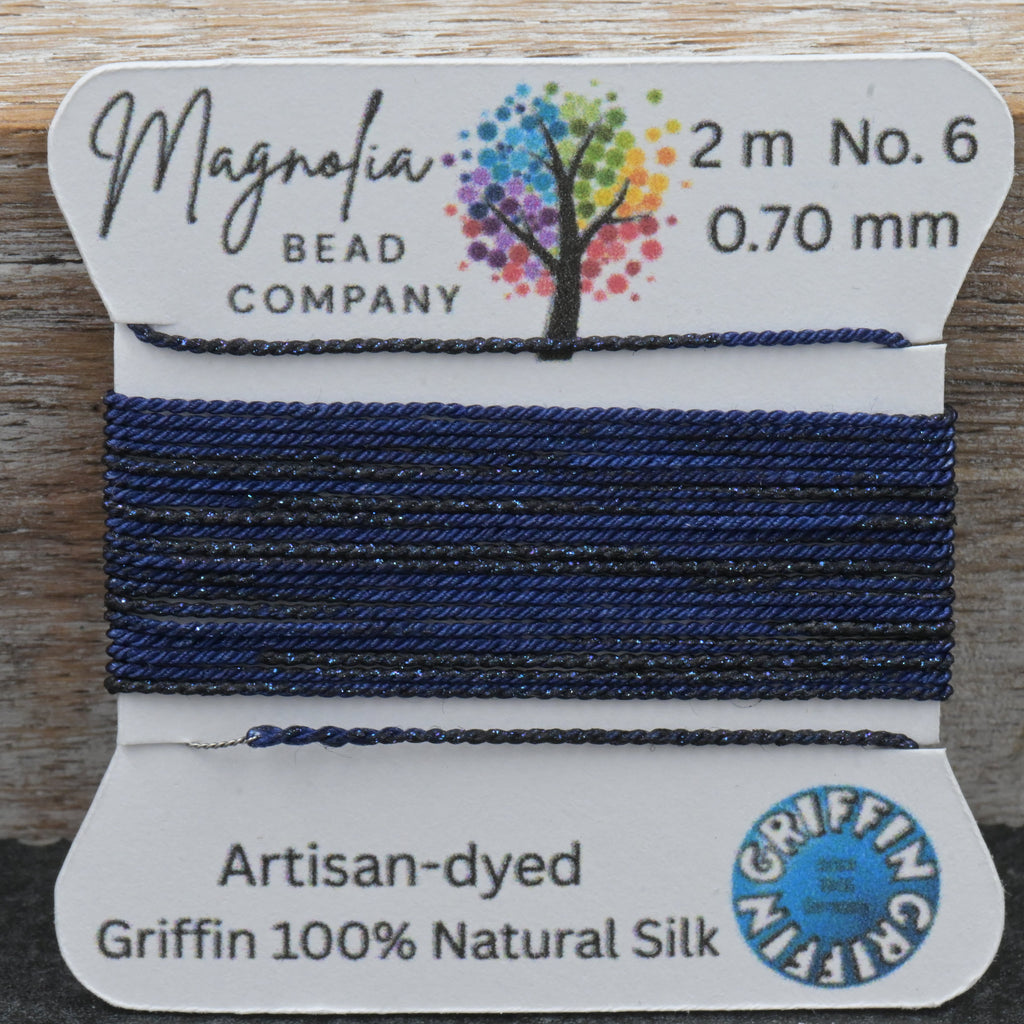 Bead thread on a card with Magnolia Bead Company branding and product details.
