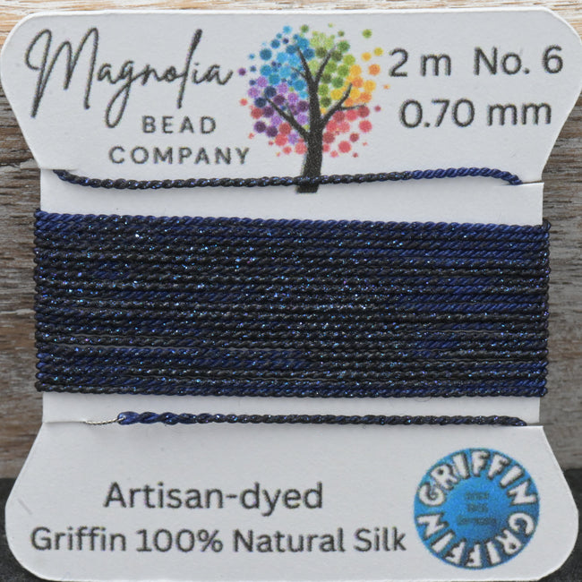 Bead thread with 'Magnolia Bead Company' label on a wooden surface Hover Image
