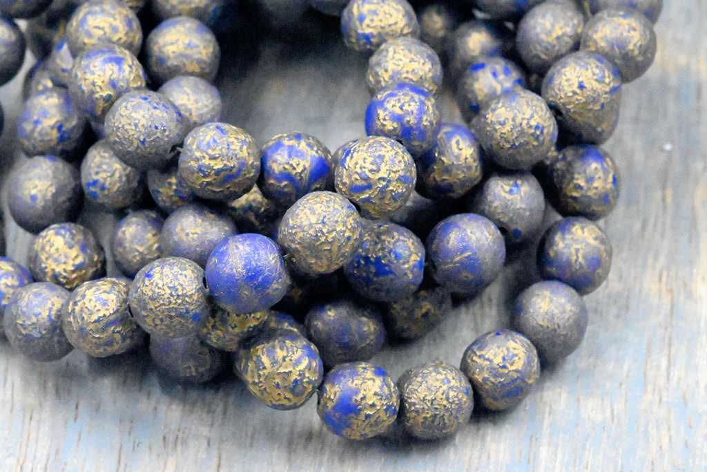 8mm Round Druk Lapis Blue with an Etched Finish Gold Wash