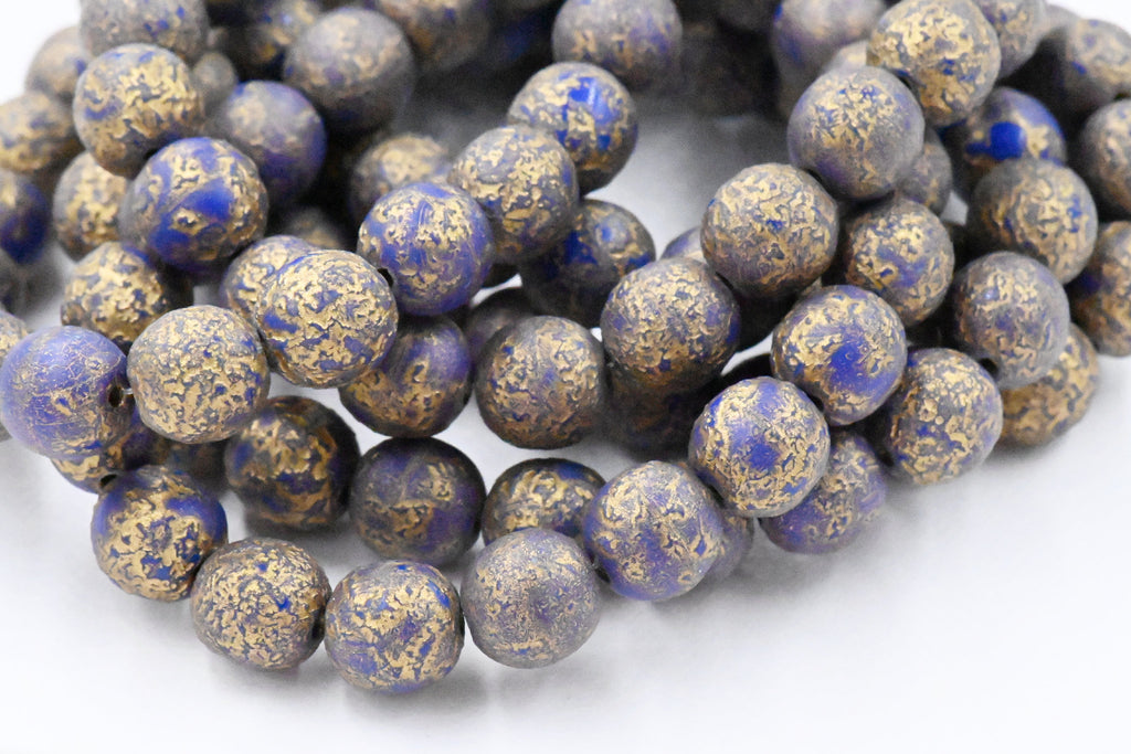 8mm Round Druk Lapis Blue with an Etched Finish Gold Wash