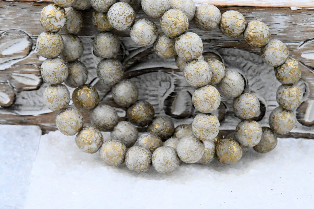 8mm Round Druk Mocha Cream with an Etched Finish Gold Wash