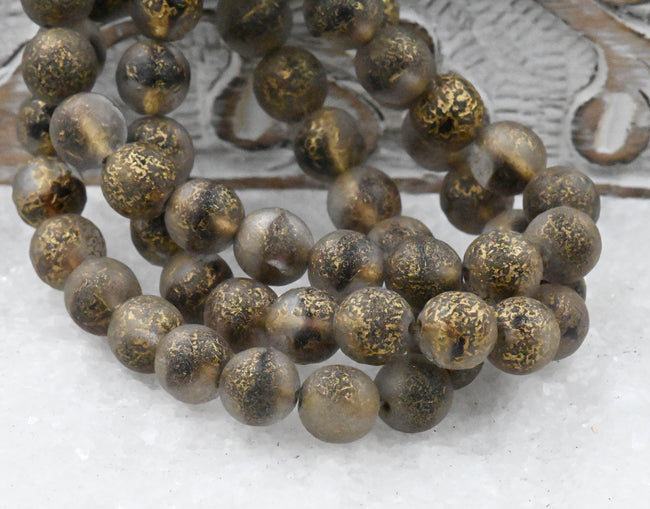 8mm Round Druk Spice Gold with an Etched Gold Finish Eggplant Accents Hover Image