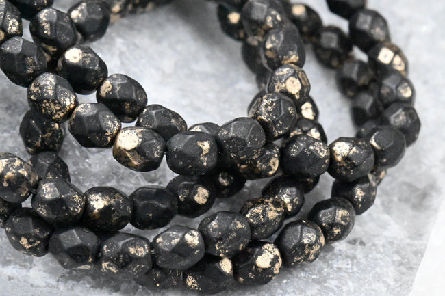 Black 6mm Faceted Czech, 25pc Gold Flake Finish Main Image