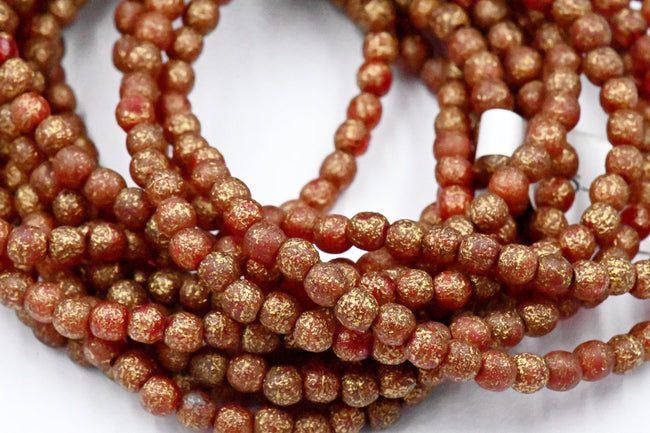 4mm Paprika Red Gold Etched Czech Round Druk Hover Image