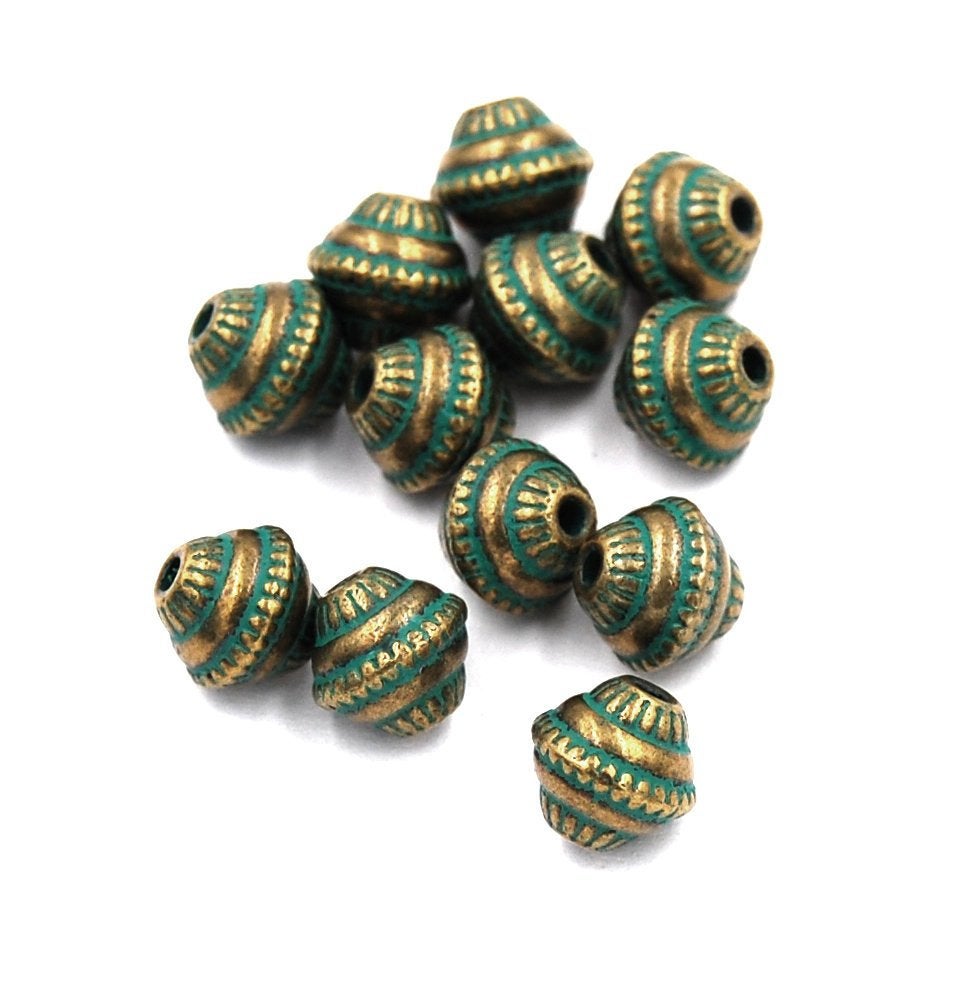 Antique Bronze/Green, 8mm bicone.  Sold per pkg of 25