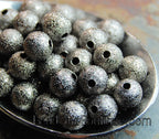Gunmetal Grey Stardust covered Brass 8mm Beads- 25