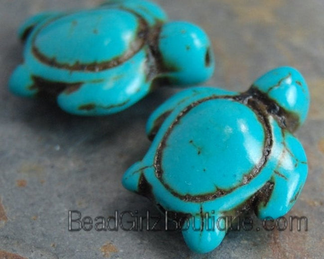 Howlite dyed turquoise blue, 14x17mm double-sided carved sea turtle -15 inch strand Hover Image